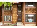 Inviting townhome with cedar siding and a well-maintained entrance at 1264 S Crystal Way, Aurora, CO 80012
