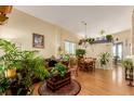 Bright living room with hardwood floors, tall ceilings, and plenty of natural light at 10554 Atwood Cir, Littleton, CO 80130