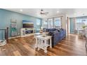 Inviting living room with hardwood floors and an open layout perfect for entertaining at 965 Peach Leaf Ln, Elizabeth, CO 80107