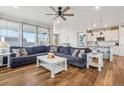 Spacious living room connects to the kitchen, offering a seamless living experience at 965 Peach Leaf Ln, Elizabeth, CO 80107