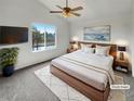 Serene bedroom with large window, plush rug, and calming artwork, virtually staged at 5521 Spruce Ave, Castle Rock, CO 80104
