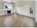 Spacious living room with hardwood floors and fireplace provides a clean and bright space at 5521 Spruce Ave, Castle Rock, CO 80104