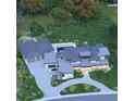 Expansive aerial view of estate with multiple garages and guest house, circular driveway, and luxurious pool and patio area at 1757 Whistlepig Ln, Broomfield, CO 80020