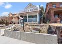 Inviting two-story home with a cozy covered porch and elevated balcony, showcasing a welcoming exterior at 16 N Pennsylvania St, Denver, CO 80203