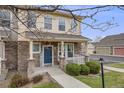 Charming two-story home with a welcoming front porch, stone accents, and well-maintained landscaping at 22765 E Ottawa Pl, Aurora, CO 80016