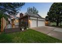 A two-car garage and deck make for a relaxing backyard atmosphere at 6402 W 81St Ave, Arvada, CO 80003