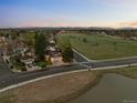 A corner lot property with a view to a spacious green space from the street is a great feature at 6402 W 81St Ave, Arvada, CO 80003