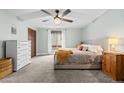 Serene main bedroom featuring a ceiling fan, plush carpet, and a light and airy ambiance at 6402 W 81St Ave, Arvada, CO 80003