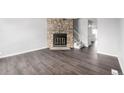 Inviting living room with a stone fireplace and modern flooring at 2927 W 81St Ave # B, Westminster, CO 80031