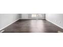 Spacious living room featuring modern wood floors and ample natural light at 2927 W 81St Ave # B, Westminster, CO 80031