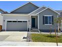 Charming single Gathering home featuring neutral siding, an attached garage, and front yard in a suburban neighborhood at 9112 Telluride Ct, Commerce City, CO 80022