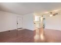 Open living room boasts hardwood floors and a neutral color palette at 10762 E Exposition Ave # 336, Aurora, CO 80012
