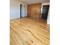 Spacious living room features gleaming hardwood floors and a convenient Murphy bed at 1131 N Lafayette St # 304, Denver, CO 80218