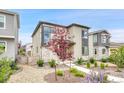 Charming two-story home with landscaped front yard and manicured plants at 8911 Eagle River St, Littleton, CO 80125