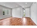 Bright living room featuring stylish flooring and ample natural light at 8911 Eagle River St, Littleton, CO 80125