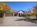 Beautiful home with a three-car garage, tidy landscaping and a charming entrance at 26781 E Clifton Dr, Aurora, CO 80016