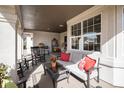 Comfortable covered patio with a seating area, perfect for relaxing outdoors at 26781 E Clifton Dr, Aurora, CO 80016