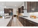 Gourmet kitchen featuring sleek countertops, stainless steel appliances, and custom cabinetry at 22183 E Rocky Top Pl, Aurora, CO 80016