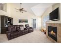 Cozy living room featuring a fireplace, plush seating, and ample natural light at 17525 Wilde Ave # 307, Parker, CO 80134