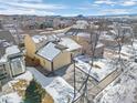 Aerial view of a house with a snow-covered yard at 4224 Deer Watch Dr, Castle Rock, CO 80104