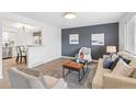Bright living room with hardwood floors, modern furnishings, and contemporary decor at 1772 S Pierce St, Lakewood, CO 80232