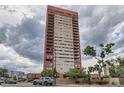 High-rise condo building featuring many balconies and modern architectural design at 100 W Park Ave Ave # 908, Denver, CO 80205