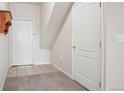 Bright entryway featuring tile flooring, coat closet, and access to the main living areas at 10259 W 55Th Dr # 103, Arvada, CO 80002