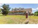 Spacious home with a large front yard and a 'For Sale' sign at 895 Antelope W Dr, Bennett, CO 80102