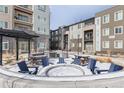 Outdoor community space with fire pit and seating area at 460 E Fremont Pl # 301, Littleton, CO 80122