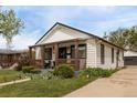 Inviting single story home showcasing a covered front porch and well-maintained lawn at 3464 S Downing St, Englewood, CO 80113
