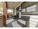 Cozy front porch with comfortable seating and great natural light at 3464 S Downing St, Englewood, CO 80113