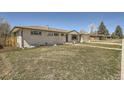 Well-maintained single-story home with a spacious yard and a detached garage at 6923 S Albion St, Centennial, CO 80122