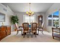 Formal dining room with wooden table, chairs, and chandelier at 1950 Five Iron Dr, Castle Rock, CO 80104