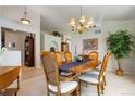 Bright dining room featuring a wood table and built-in shelving at 1950 Five Iron Dr, Castle Rock, CO 80104