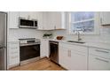 Modern kitchen featuring stainless steel appliances, white cabinets, and bright countertops at 525 W Midway Blvd, Broomfield, CO 80020