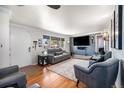 Cozy living room with hardwood floors and stylish gray furniture, perfect for relaxing at 7071 Beach St, Westminster, CO 80030