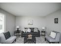 Cozy living room with neutral paint, comfortable seating, and natural light at 17657 E Prentice Cir, Aurora, CO 80015