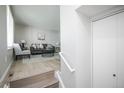 Bright living room with new floors and staircase at 17657 E Prentice Cir, Aurora, CO 80015