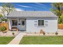 Well-kept single-story house boasting a neat lawn and welcoming front entrance at 935 Newark St, Aurora, CO 80010