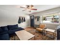 Inviting living room with hardwood floors, modern decor, and ample natural light for a comfortable living space at 6676 S Kit Carson St, Centennial, CO 80121