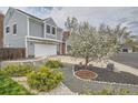 Well-manicured gray home with a lush front yard and tasteful landscaping at 5275 Holmes Pl, Boulder, CO 80303