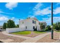 Corner lot home featuring a spacious yard, white fencing, and a manicured lawn, perfect for outdoor activities and privacy at 4528 Andes St, Denver, CO 80249