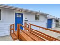 Close up of house entrance with blue door and accessible ramp at 621 Campo St, Denver, CO 80221