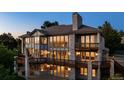 Beautiful home exterior boasting multiple balconies and floor-to-ceiling windows at 96 Falcon Hills Dr, Highlands Ranch, CO 80126