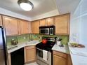 Cozy kitchen featuring ample natural light and stainless steel appliances at 1833 N Williams St # 507, Denver, CO 80218