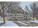 Charming home with three-car garage and manicured lawn in a peaceful neighborhood at 11191 Cimarron St, Firestone, CO 80504