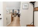 Entryway showing hardwood floors flowing into a large open-concept living area at 11031 Marshall St, Westminster, CO 80020