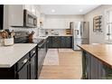 Updated kitchen featuring white cabinets, stainless steel appliances and butcher block countertop at 11031 Marshall St, Westminster, CO 80020