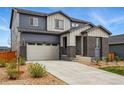 Beautiful two-story home featuring a two-car garage, brick accents, and a manicured front yard at 11744 Magnolia Dr, Thornton, CO 80233