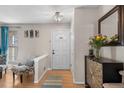 Inviting entryway features a neutral palette, hardwood floors, and decor that offers a warm and stylish welcome at 15865 E Kepner Dr, Aurora, CO 80017